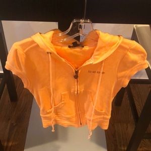 Orange BEBE short sleeve hoodie size small.